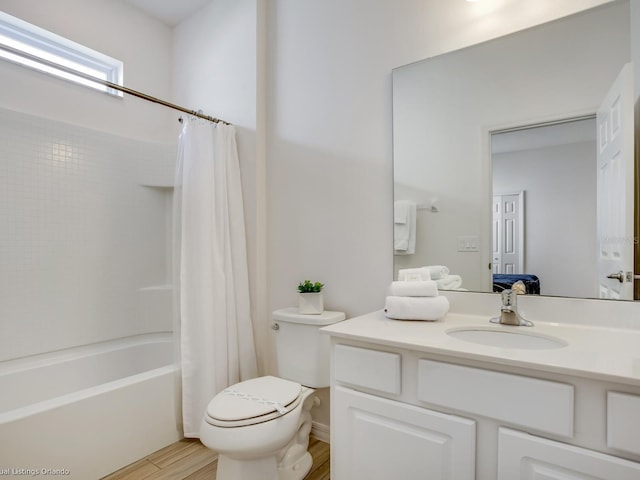 full bathroom with toilet, vanity, shower / bath combo, and hardwood / wood-style flooring