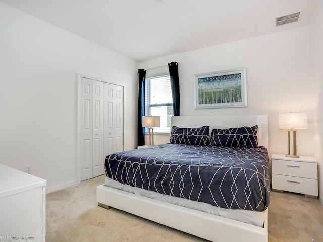 carpeted bedroom featuring a closet