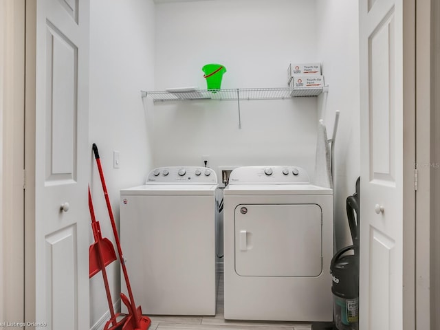 laundry room featuring separate washer and dryer