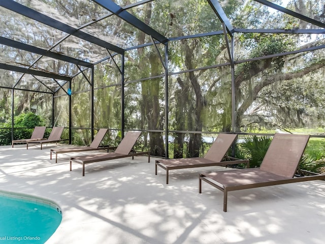 view of patio with a lanai