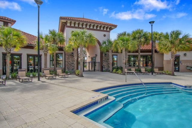 view of swimming pool featuring a patio area