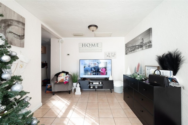 tiled living room with a textured ceiling