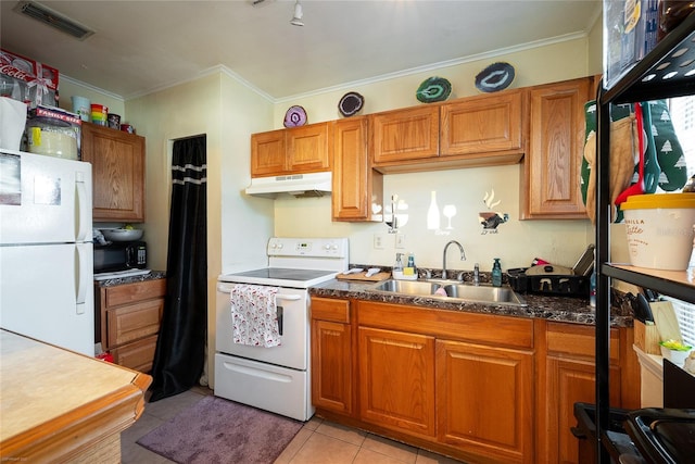 kitchen with light tile patterned flooring, white appliances, crown molding, and sink