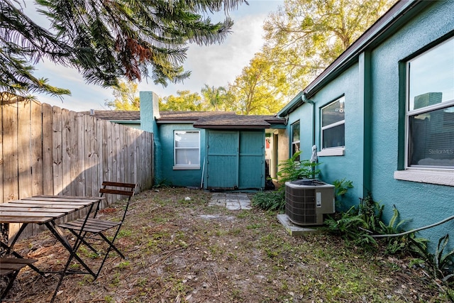 view of yard featuring central air condition unit