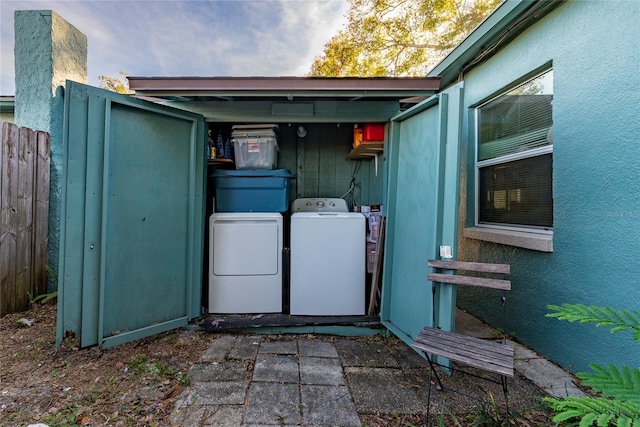 laundry area with washing machine and dryer