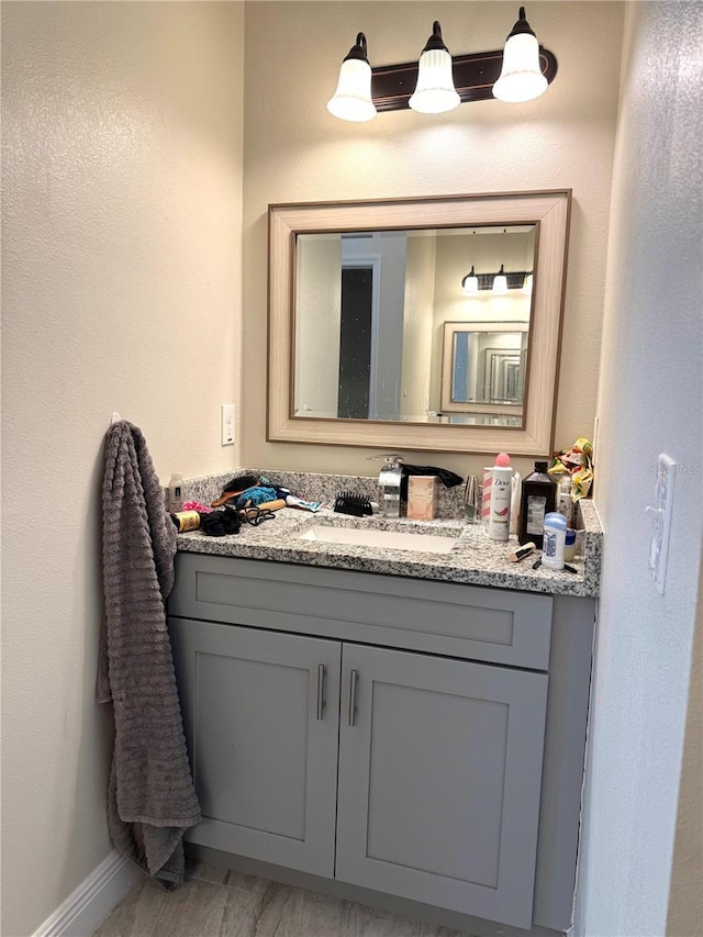 bathroom featuring hardwood / wood-style flooring and vanity