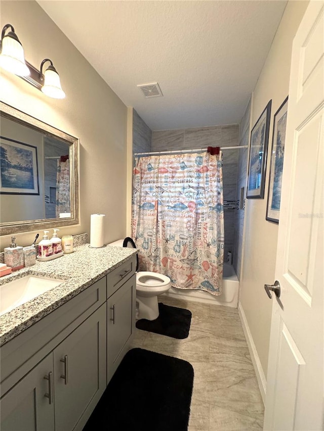 full bathroom with a textured ceiling, vanity, toilet, and shower / bath combo with shower curtain