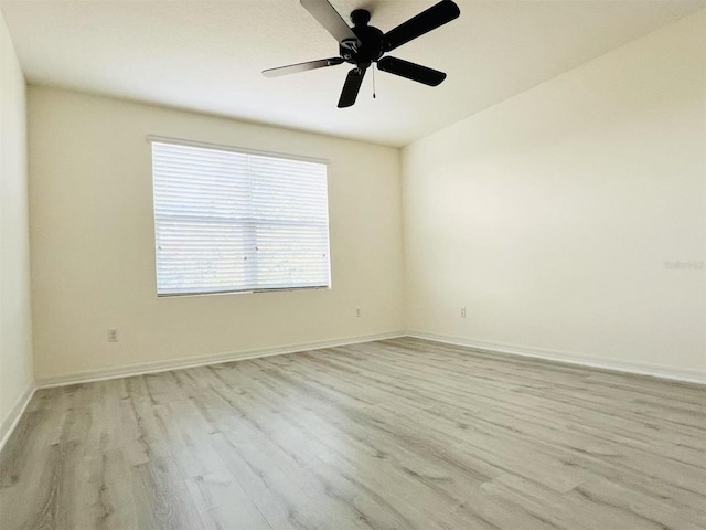 spare room with light hardwood / wood-style floors and ceiling fan