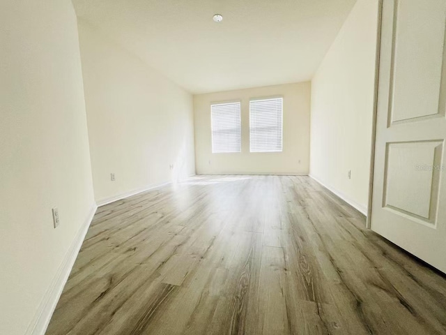 unfurnished room with light hardwood / wood-style floors