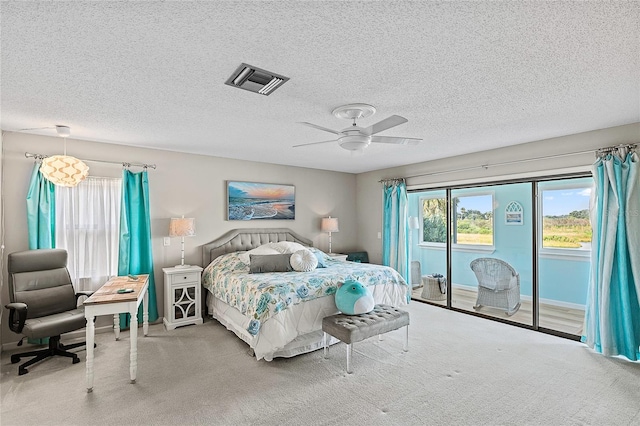 bedroom with carpet floors, ceiling fan, access to exterior, and multiple windows