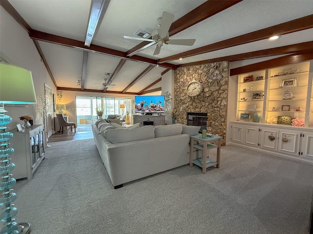 1433 Lake Marion Dr, Apopka, FL 32712 - living area with lofted ceiling with beams, ceiling fan, a large fireplace, light colored carpet, and visible vents
