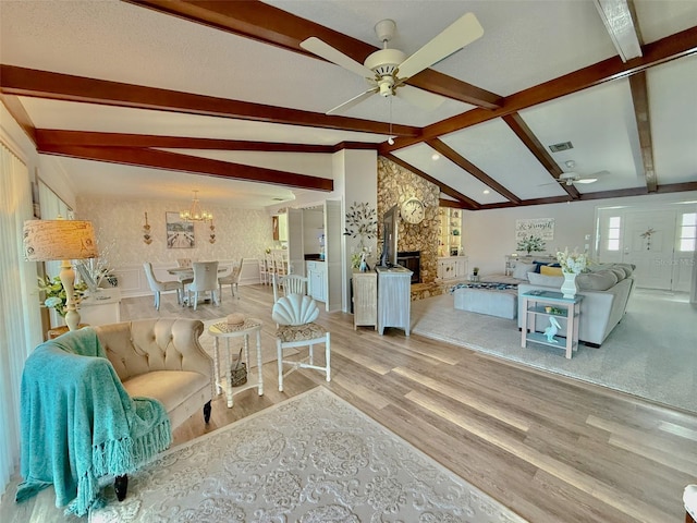 1433 Lake Marion Dr, Apopka, FL 32712 - living area with lofted ceiling with beams, wood finished floors, visible vents, and ceiling fan with notable chandelier