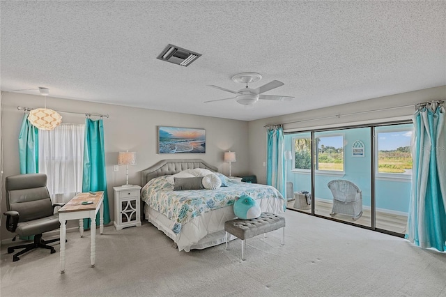 1433 Lake Marion Dr, Apopka, FL 32712 - bedroom featuring carpet floors, access to outside, a textured ceiling, and visible vents