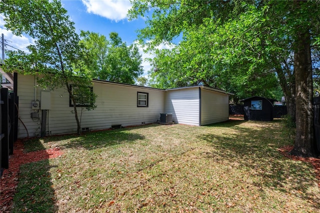 2803 E Pine St, Orlando, FL 32803 - exterior space with fence, central AC, a storage unit, an outbuilding, and a yard