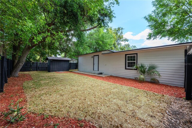 2803 E Pine St, Orlando, FL 32803 - exterior space featuring a fenced backyard, an outbuilding, and a storage shed