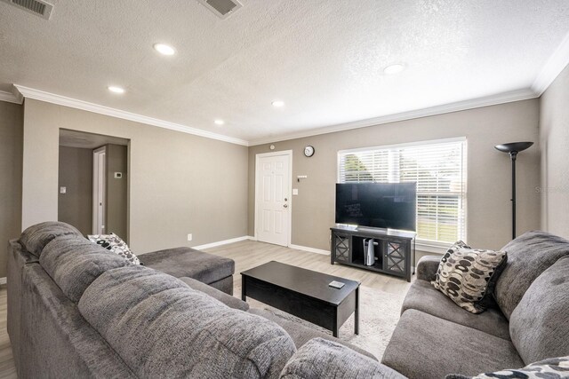 2803 E Pine St, Orlando, FL 32803 - living area featuring baseboards, visible vents, crown molding, and light wood-style flooring