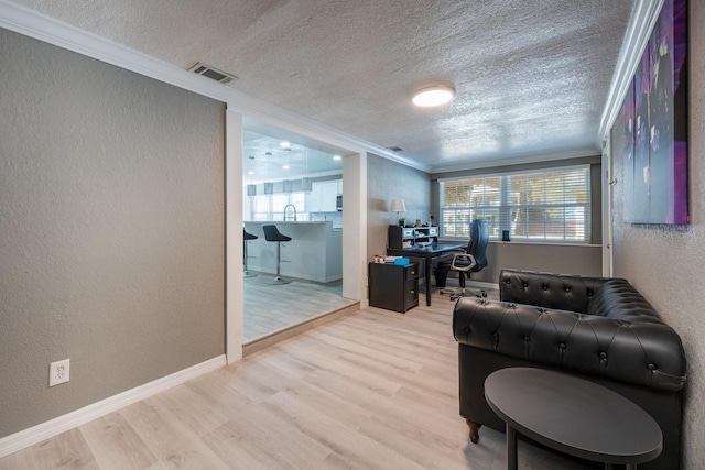 2803 E Pine St, Orlando, FL 32803 - home office with visible vents, crown molding, wood finished floors, and a textured wall