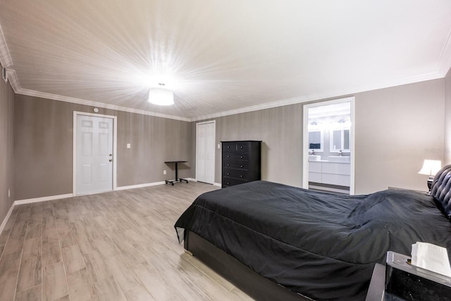 2803 E Pine St, Orlando, FL 32803 - bedroom featuring ensuite bath, crown molding, baseboards, and light wood-type flooring
