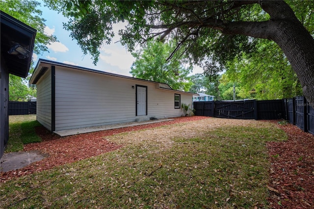 2803 E Pine St, Orlando, FL 32803 - back of property with a gate, a fenced backyard, and a yard