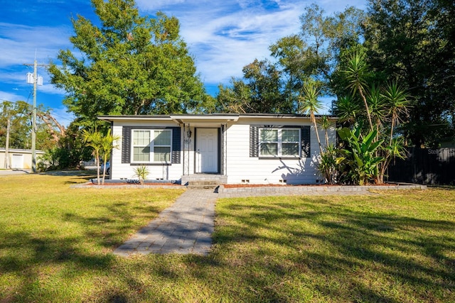 2803 E Pine St, Orlando, FL 32803 - view of front facade with a front lawn and crawl space