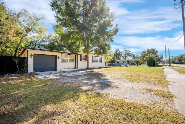 2803 E Pine St, Orlando, FL 32803 - ranch-style home with a garage, a front lawn, and fence