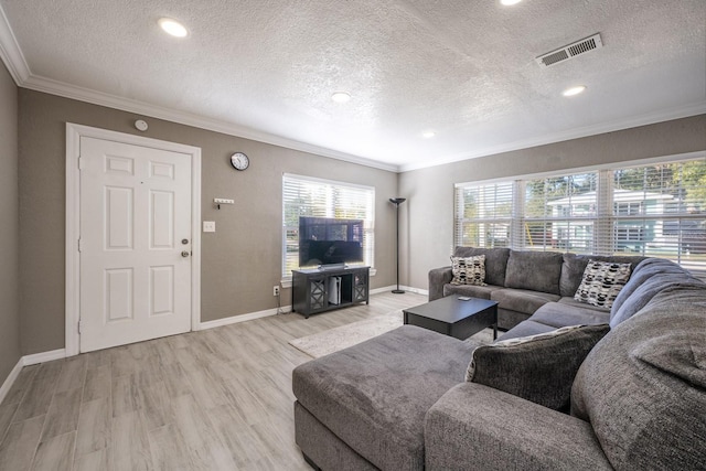 2803 E Pine St, Orlando, FL 32803 - living area with baseboards, ornamental molding, visible vents, and light wood-type flooring