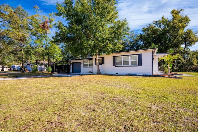 2803 E Pine St, Orlando, FL 32803 - ranch-style house with a front lawn, crawl space, and an attached garage