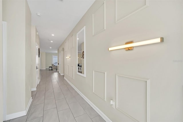 hallway with light tile patterned floors