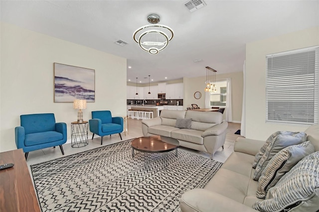 living room featuring a chandelier