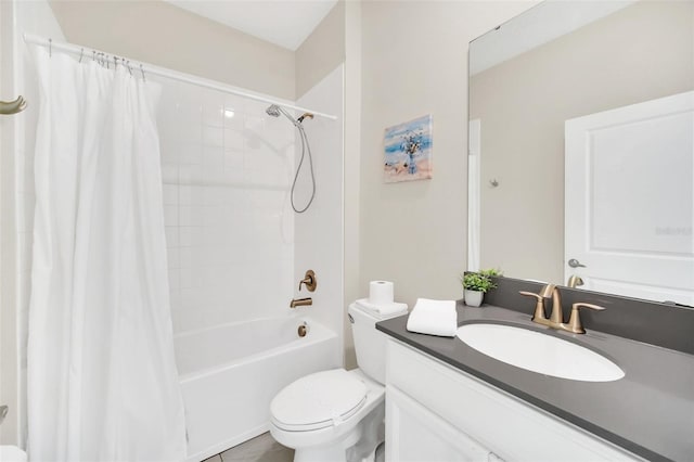 full bathroom featuring toilet, shower / tub combo, and vanity