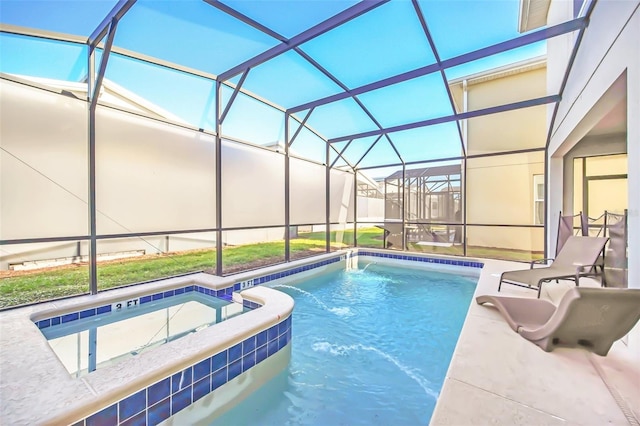 view of pool featuring glass enclosure and a patio