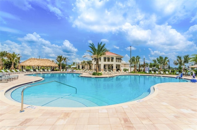 view of swimming pool with a patio