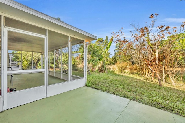 view of patio / terrace featuring a sunroom