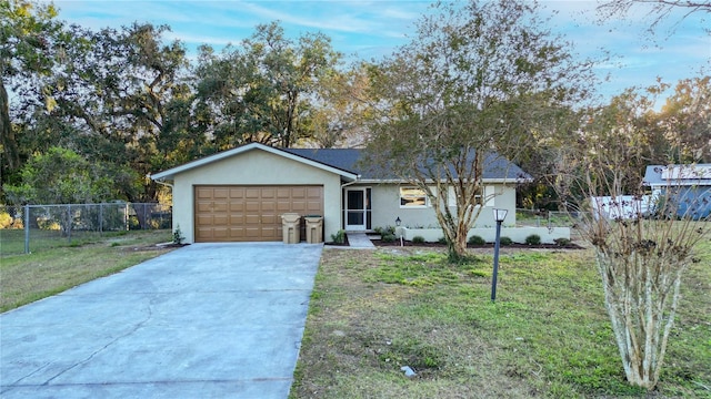 ranch-style house with a garage and a front lawn