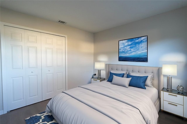 bedroom featuring a closet and dark wood-type flooring