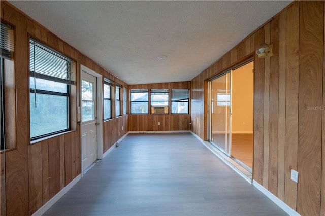 unfurnished sunroom featuring cooling unit