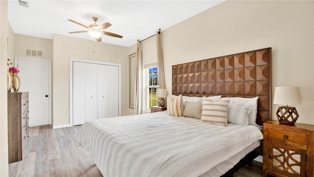 bedroom with ceiling fan and light hardwood / wood-style floors