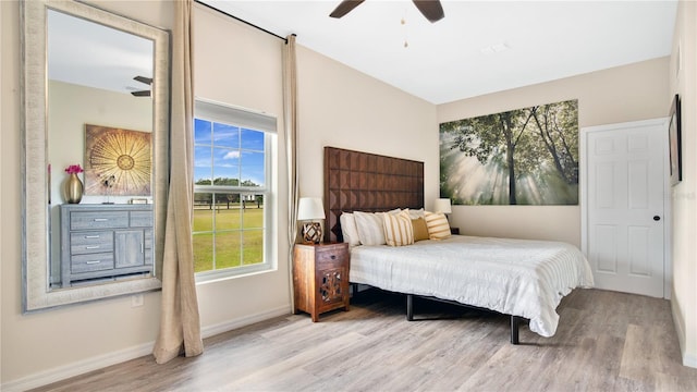 bedroom with ceiling fan and light wood-type flooring