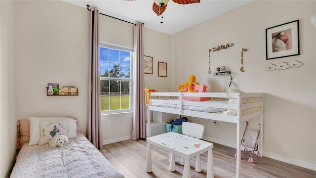 bedroom featuring ceiling fan and light hardwood / wood-style floors