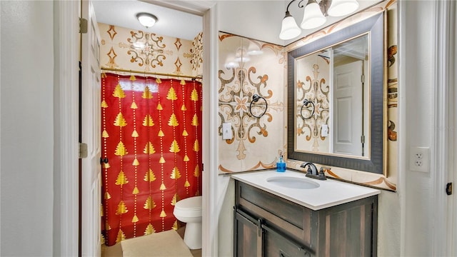 bathroom with vanity and toilet