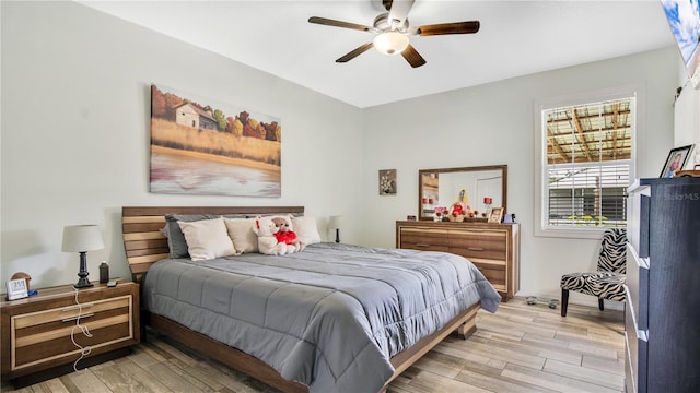 bedroom featuring ceiling fan and light hardwood / wood-style floors