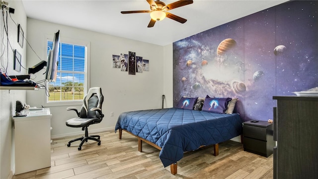 bedroom featuring ceiling fan and light hardwood / wood-style flooring