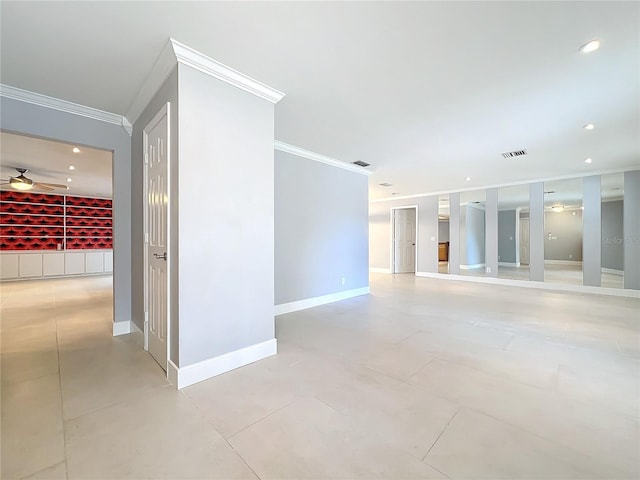 empty room featuring ceiling fan, recessed lighting, visible vents, baseboards, and crown molding