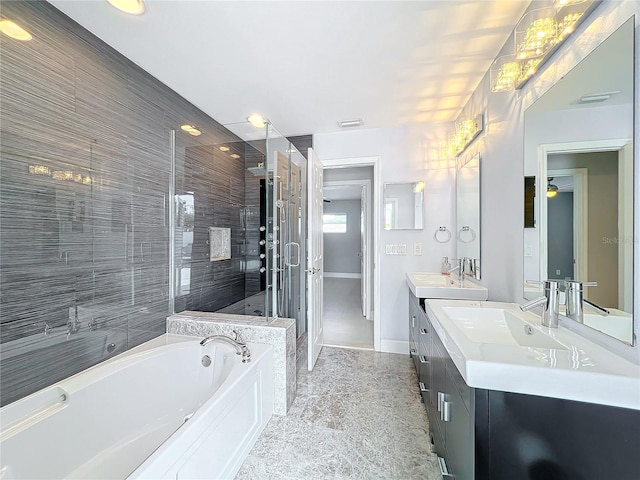 bathroom with a shower stall, visible vents, a bath, and vanity