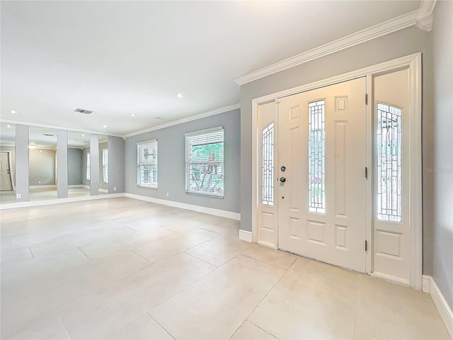 entryway with baseboards, light tile patterned flooring, and crown molding