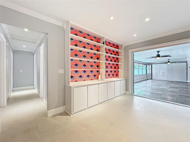 wine area with baseboards, ornamental molding, and recessed lighting