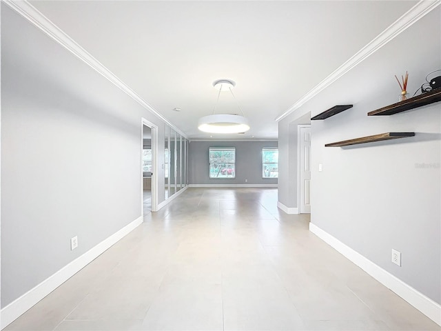 interior space featuring ornamental molding and baseboards