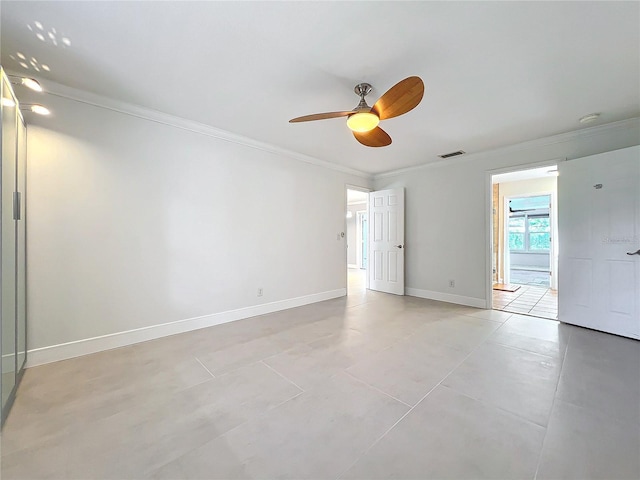 unfurnished room with ceiling fan, ornamental molding, visible vents, and baseboards