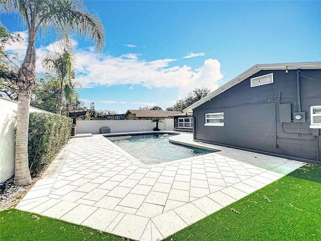 view of pool with a fenced in pool, a fenced backyard, and a patio