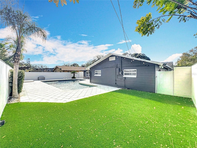 exterior space featuring a lawn, a patio area, a fenced backyard, and a fenced in pool